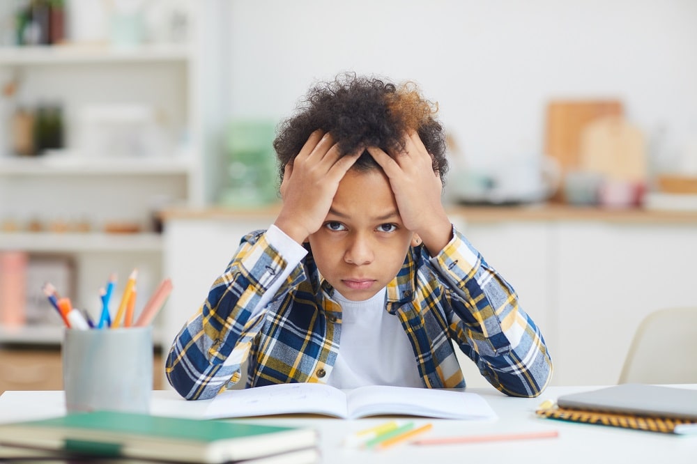 6 Ways to Tell if Your Kid Is Struggling With School & How to Help Them