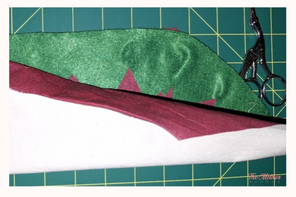 Bring the bottom edge of your fabric up and line it up with the top