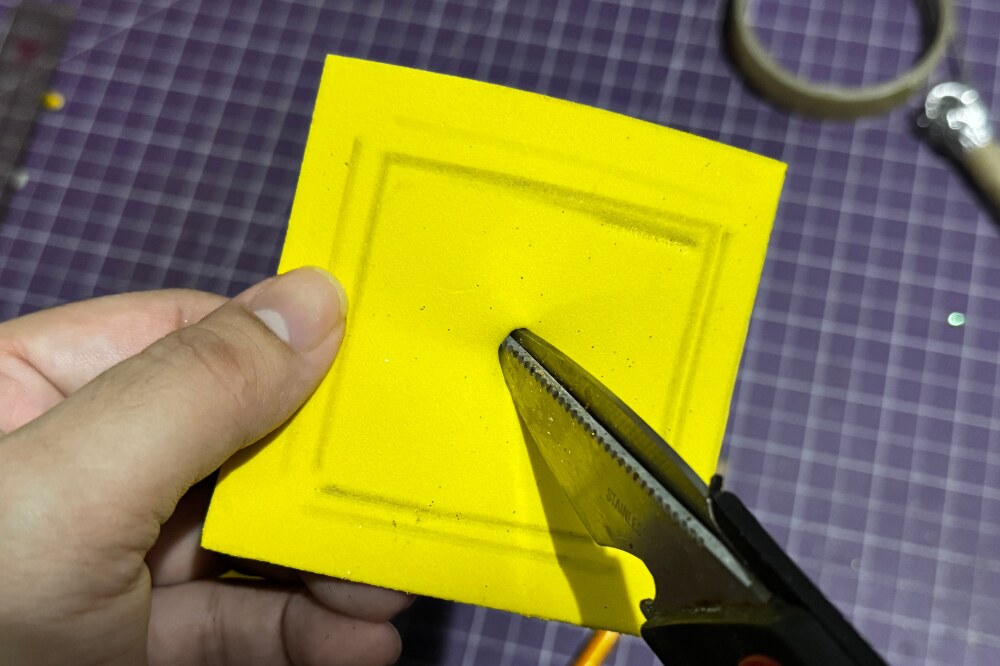 Punch a hole in the center