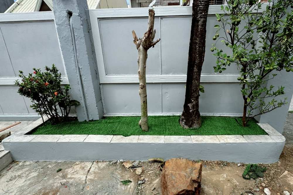 Adding fake bermuda grass in raised garden bed