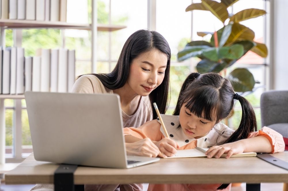 Family studying online together