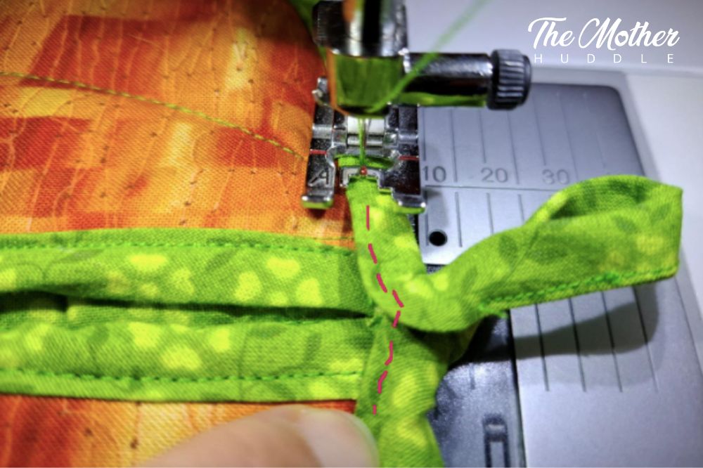 DIY Autumnal Pot Holders Pumpkin Step 9 - Get to your loop, you’ll have a slight peak, just stitch along the folded edge