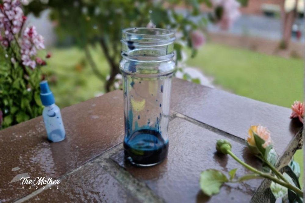 Add the food dye to your small glass jar
