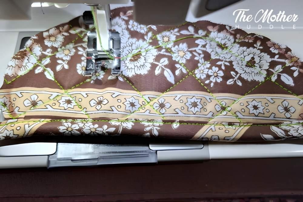 DIY Acorn Pot holder Step 5 - Turn in the raw edge of your binding and topstitch it down