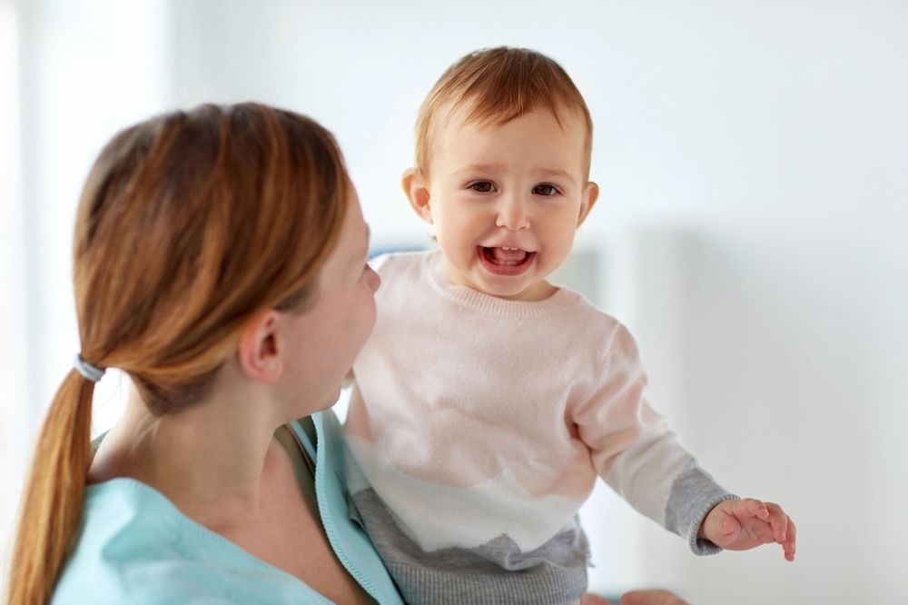 Mommy is talking to her toddler