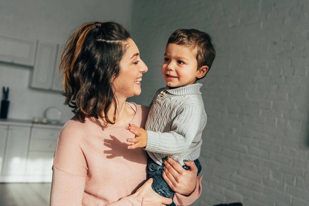 Mom and toddler son talking